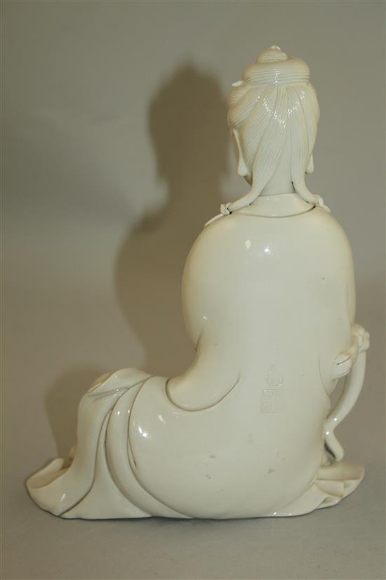 A Chinese blanc de chine seated figure of Guanyin, 20th century, 20.5cm